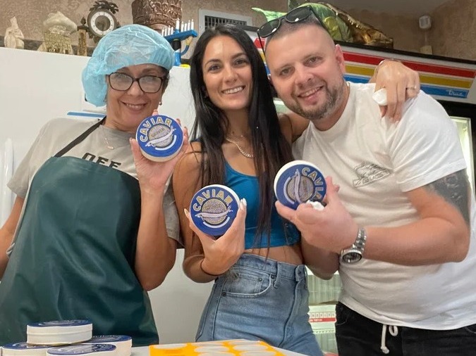 The Caviar Market family packing tins of Kaluga Queen caviar